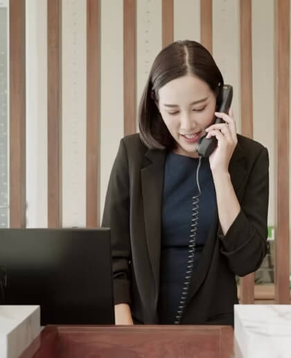 Female using a telephone